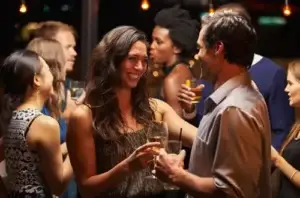 people clinking glasses at a wedding reception